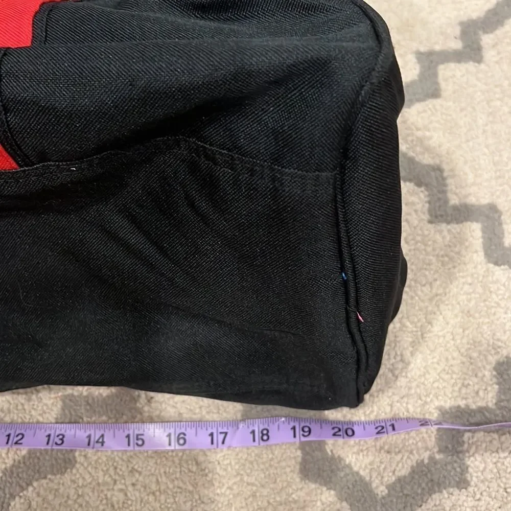 True Religion Black and Red Strap Duffel Bag